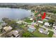 Aerial view of the property on canal with waterfront access and in-ground pool at 5716 Gibson Shores Dr, Lakeland, FL 33809