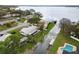 Aerial view of a waterfront home with a metal roof on a canal with easy access to a large lake at 5716 Gibson Shores Dr, Lakeland, FL 33809