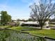 Charming waterfront home with a spacious backyard, screened in porch, and private dock at 5716 Gibson Shores Dr, Lakeland, FL 33809