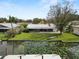 Inviting waterfront home with a spacious backyard, screened in porch, and private dock at 5716 Gibson Shores Dr, Lakeland, FL 33809