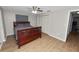 Comfortable bedroom featuring wood-look floors, ceiling fan, and spacious closet at 5716 Gibson Shores Dr, Lakeland, FL 33809
