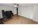 Spacious bedroom with ample closet space and wood-look flooring at 5716 Gibson Shores Dr, Lakeland, FL 33809