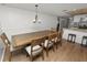 The dining room area features a large wooden table, six chairs, and recessed lighting at 5716 Gibson Shores Dr, Lakeland, FL 33809