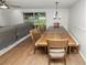 View of the dining room featuring a large wooden table with seating in an open concept area at 5716 Gibson Shores Dr, Lakeland, FL 33809