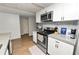 Stylish kitchen with stainless steel appliances, white cabinets, and lots of counter space at 5716 Gibson Shores Dr, Lakeland, FL 33809