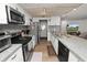 Well-equipped kitchen with granite countertops and stainless steel appliances, open layout at 5716 Gibson Shores Dr, Lakeland, FL 33809