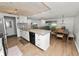 Modern kitchen and dining area featuring stainless steel appliances and an open floor plan at 5716 Gibson Shores Dr, Lakeland, FL 33809