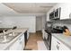 Spacious kitchen with stainless steel appliances, granite countertops, and a dining area at 5716 Gibson Shores Dr, Lakeland, FL 33809