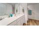 Bright bathroom featuring a white vanity with quartz countertop and shower with modern fixtures at 6296 Dolostone Dr, Lakeland, FL 33811
