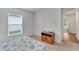 Bright bedroom with a patterned bedspread and a wooden cabinet at 6296 Dolostone Dr, Lakeland, FL 33811