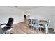Open-concept dining room with wood floors and ample natural light at 6296 Dolostone Dr, Lakeland, FL 33811