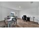 Open concept dining area with wood-look floors and natural light at 6296 Dolostone Dr, Lakeland, FL 33811