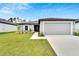 Charming single-story home with well-manicured lawn and a two-car garage at 6296 Dolostone Dr, Lakeland, FL 33811