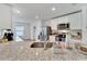 Bright kitchen features granite countertops, stainless steel appliances, and ample cabinet space at 6296 Dolostone Dr, Lakeland, FL 33811