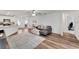View of the living room flowing into the kitchen, with an open concept design at 6296 Dolostone Dr, Lakeland, FL 33811