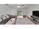 Spacious living room with sliding glass doors that leads to the backyard at 6296 Dolostone Dr, Lakeland, FL 33811