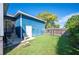 Private backyard featuring a patio, storage shed, and green grass, perfect for relaxation and outdoor activities at 631 W Park St, Lakeland, FL 33803
