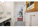 Bathroom with a patterned tile floor leading to the primary bedroom at 631 W Park St, Lakeland, FL 33803
