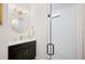 Bathroom features glass shower, black vanity, and stylish fixtures at 631 W Park St, Lakeland, FL 33803