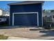 Detached two car garage with ample parking space on a sunny day at 631 W Park St, Lakeland, FL 33803