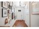 Hallway with hardwood floors, gallery wall, and barn door detail at 631 W Park St, Lakeland, FL 33803