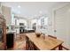 Bright kitchen features white cabinetry, stainless appliances, and a large center island with bar seating at 631 W Park St, Lakeland, FL 33803