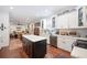 Kitchen includes white cabinetry, stainless appliances, an island, and open access to the living room at 631 W Park St, Lakeland, FL 33803