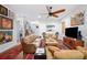 Inviting living room featuring hardwood floors, rugs, and varied art pieces at 631 W Park St, Lakeland, FL 33803
