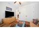 Living room with television and view leading to another bedroom at 631 W Park St, Lakeland, FL 33803