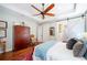 Spacious main bedroom with a ceiling fan, hardwood floors, and natural light at 631 W Park St, Lakeland, FL 33803