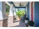 Comfortable porch featuring a rocking chair and views of lush foliage at 631 W Park St, Lakeland, FL 33803
