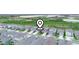 A birds-eye view showcases the neighborhood's layout, houses, and surrounding green spaces with a locator graphic at 6533 Great Bear Dr, Lakeland, FL 33805