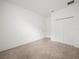 Bedroom featuring neutral carpeting, white walls, and a white closet at 6533 Great Bear Dr, Lakeland, FL 33805
