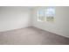 Sunlit carpeted bedroom featuring large windows and ample natural light at 6533 Great Bear Dr, Lakeland, FL 33805
