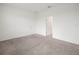 Simple, bright bedroom with carpet, neutral walls, and closet at 6533 Great Bear Dr, Lakeland, FL 33805
