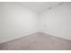 Bedroom featuring neutral carpeting, white walls, and a white door at 6533 Great Bear Dr, Lakeland, FL 33805