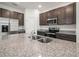 Modern kitchen featuring granite countertops and stainless steel appliances at 6533 Great Bear Dr, Lakeland, FL 33805