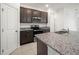 Updated kitchen boasts granite counters, stainless steel appliances, and stylish cabinetry at 6533 Great Bear Dr, Lakeland, FL 33805