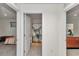 Shared bathroom with a shower/bath combo, view from adjacent bedrooms at 6769 Se 3Rd Loop, Ocala, FL 34472