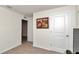 This bedroom features carpet, a picture on the wall and white trim at 6769 Se 3Rd Loop, Ocala, FL 34472