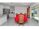 Dining area adjacent to the kitchen, featuring a table with seating for six, next to stainless steel appliances at 6769 Se 3Rd Loop, Ocala, FL 34472