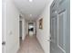 Inviting hallway with tile flooring and neutral walls leading to living areas at 6769 Se 3Rd Loop, Ocala, FL 34472