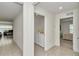 Hallway view with a laundry room and a bedroom on each side, providing convenient access and functionality at 6769 Se 3Rd Loop, Ocala, FL 34472