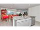 Bright kitchen featuring stainless steel appliances, and a central island with granite countertop and a dining area at 6769 Se 3Rd Loop, Ocala, FL 34472