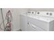 Efficient laundry room with modern washer and dryer units and convenient outlets at 6769 Se 3Rd Loop, Ocala, FL 34472