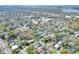 View of property surrounded by mature trees and urban landscape in a desirable neighborhood location at 810 Orange Park Ave, Lakeland, FL 33801