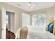 Bright bedroom with a large window, a ceiling fan, and neutral walls at 810 Orange Park Ave, Lakeland, FL 33801