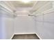 Walk in closet with shelving, ideal for organization and storage at 810 Orange Park Ave, Lakeland, FL 33801