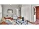 Bright living room with stylish furniture, rug, and access to multiple rooms at 810 Orange Park Ave, Lakeland, FL 33801