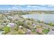 Breathtaking aerial view of the property showcasing its serene lakeside location and proximity to downtown at 827 Sikes Blvd, Lakeland, FL 33815
